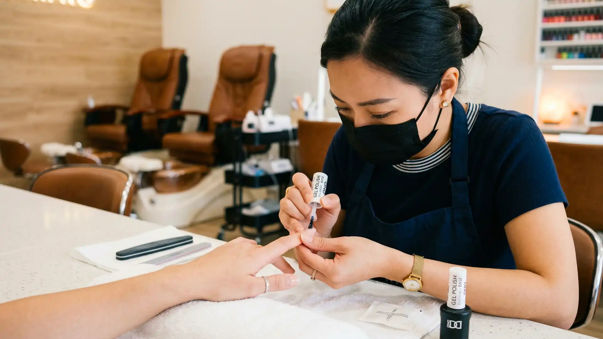 Nail Technician Applying Gel Polish